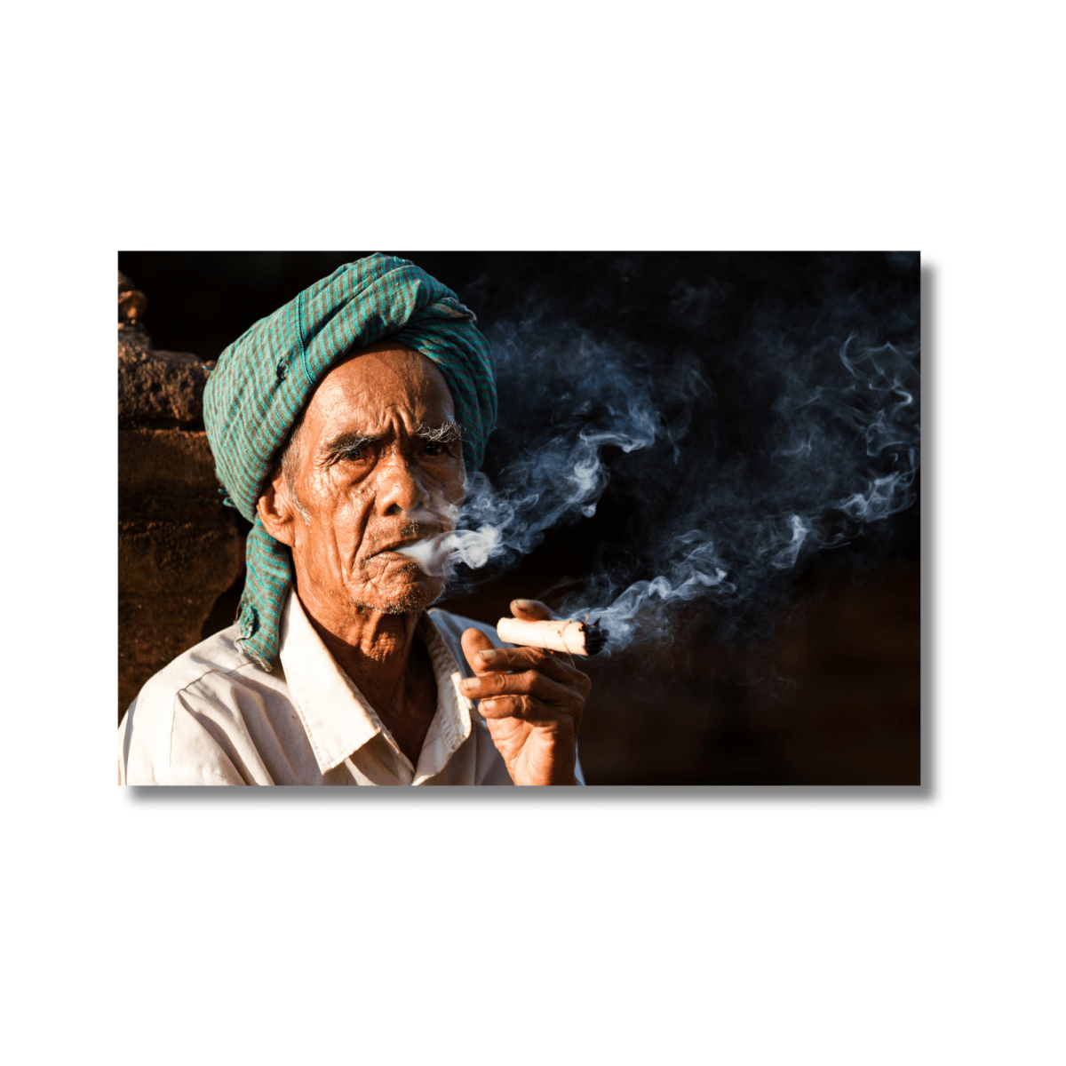 Portrait of an elderly man smoking in front of a temple in Bagan, Myanmar — limited edition cultural photography wall art print.