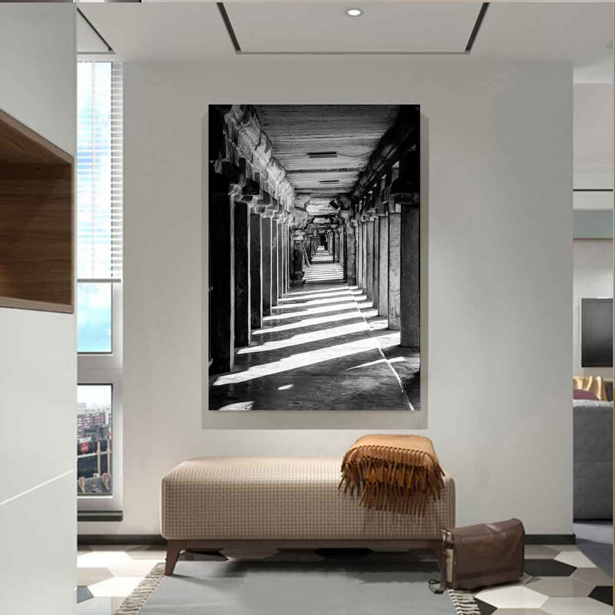 Photograph of stone beam corridor at Brihadisvara Temple displayed in a modern interior with neutral tones.