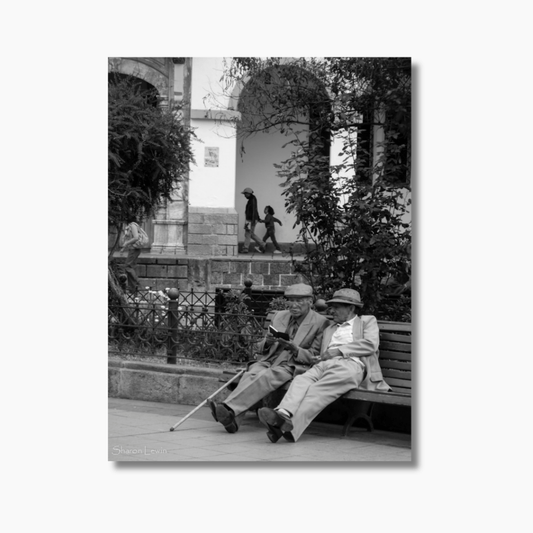 Two elderly friends sitting on a park bench in Cuenca, Ecuador — limited edition fine art friendship photography wall art print.