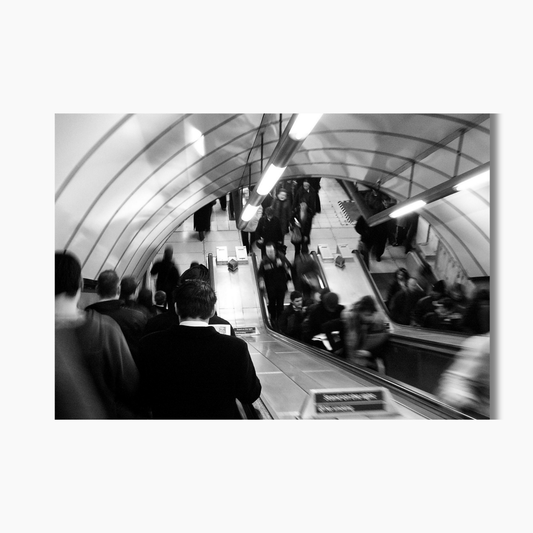 Blurred commuters walking through London during rush hour — limited edition UK street photography wall art print.