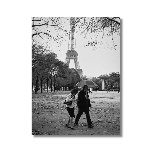 Couple walking beneath the Eiffel Tower in autumn, Paris — limited edition romantic photography wall art print.