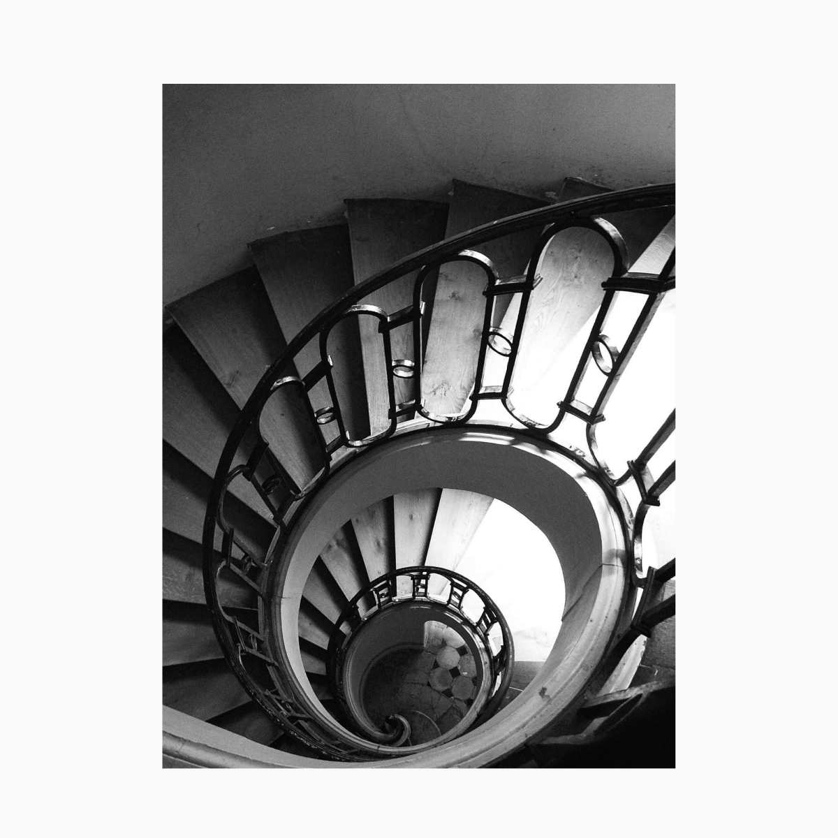 Looking down a spiral staircase in Paris, France — limited edition fine art architectural photography print.