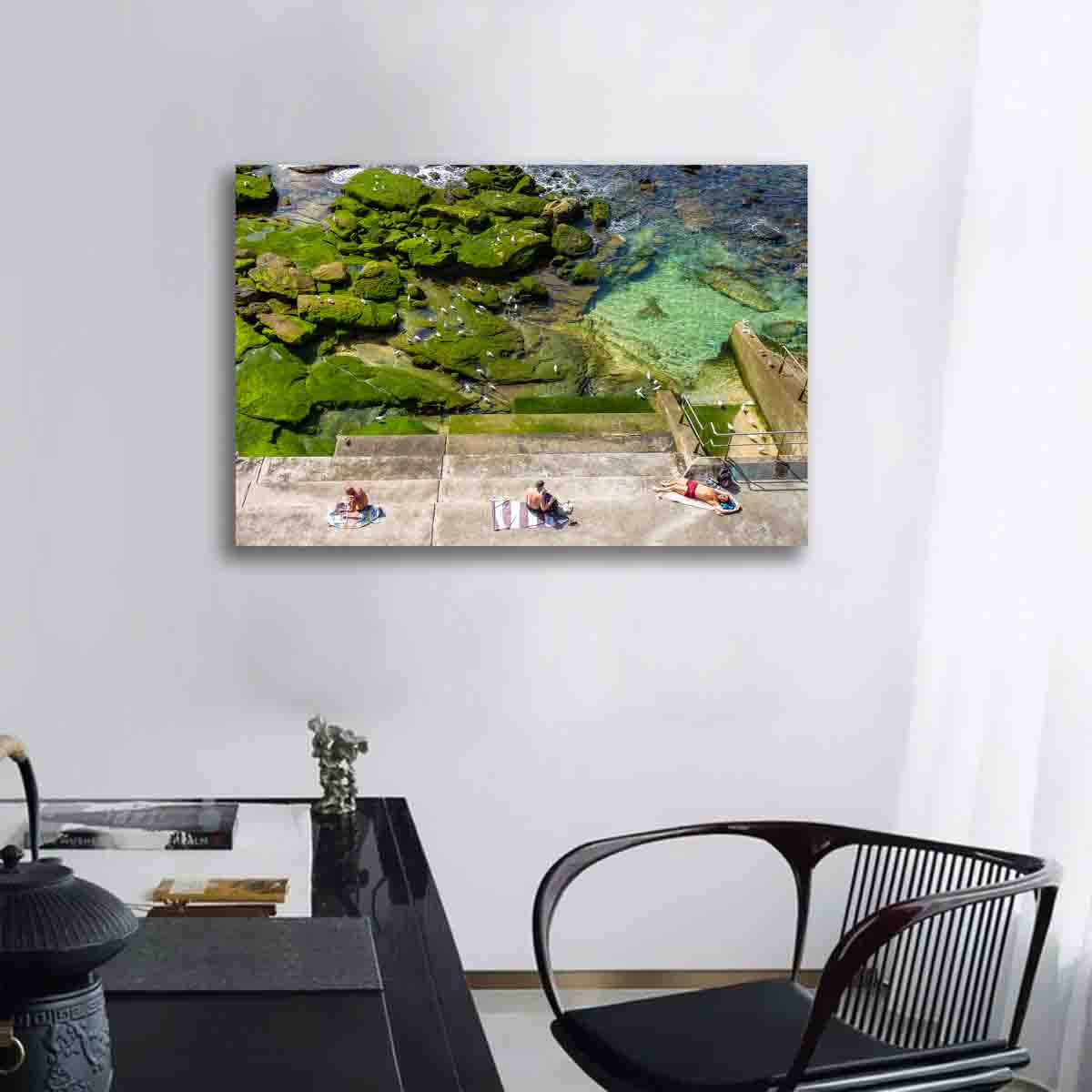 Bondi Beach photography print of sunbakers in the sun, displayed in a contemporary beach-style interior.