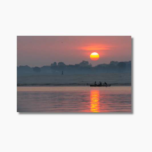 Boat on the Ganges River at sunrise in Varanasi, India — limited edition fine art photography print with golden light and spiritual atmosphere.