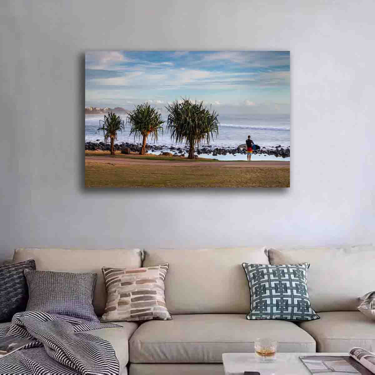 Burleigh Heads surf photography print featuring a surfer near trees at sunrise, displayed in a peaceful coastal interior.