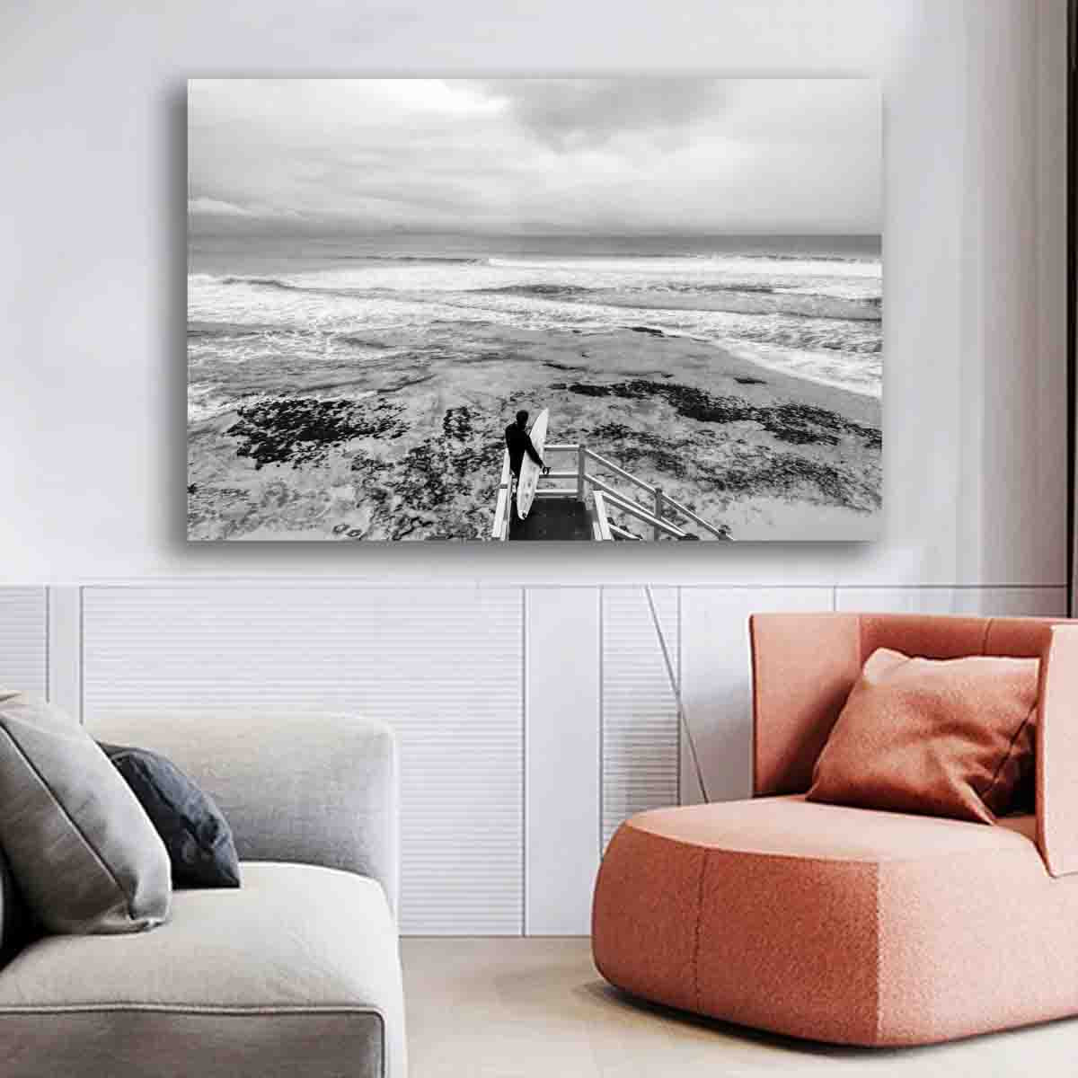 Surf photography wall art featuring a lone surfer at Torquay beach, displayed in a coastal-inspired modern interior.