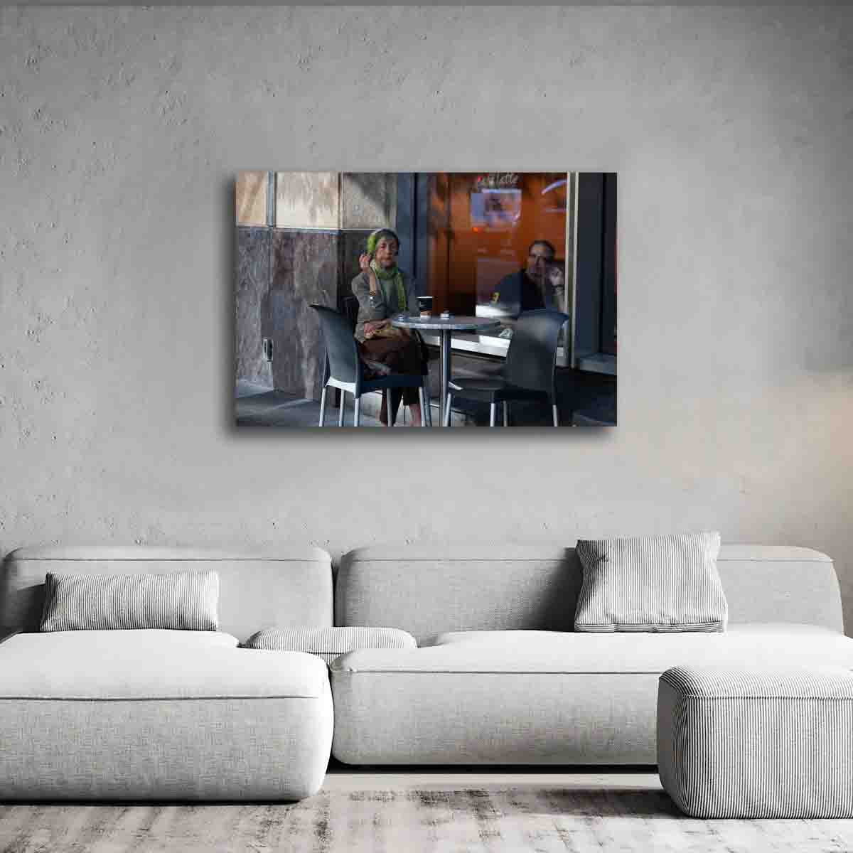 Sydney woman with coffee street photography print displayed in a soft-toned, contemplative interior setting.