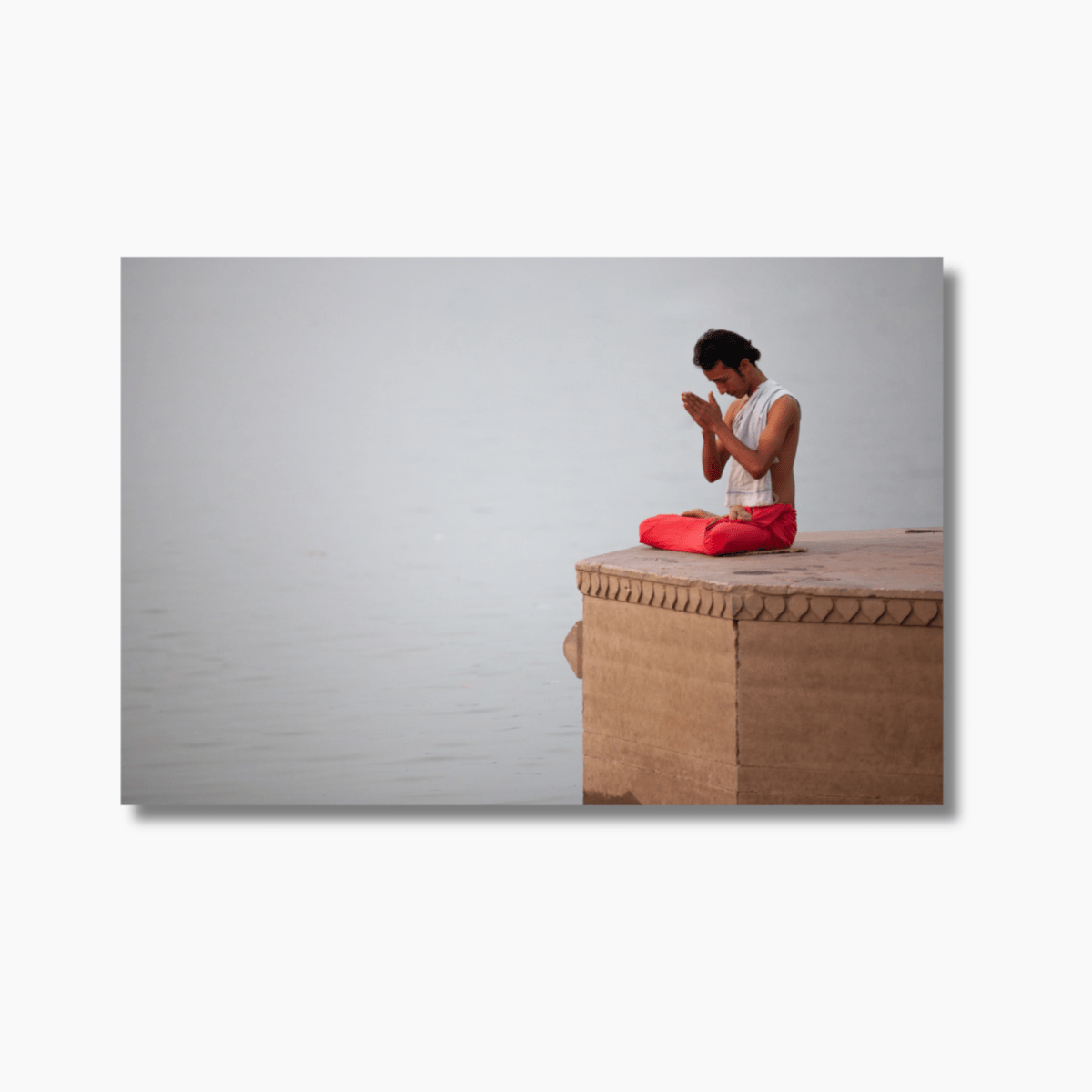 Man praying at a ghat on the Ganges River in Varanasi, India — limited edition fine art spiritual photography wall print.