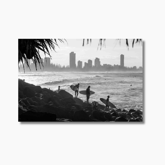 Surfers lining up to jump in off the rocks at Burleigh Heads headland — limited edition Australian surf photography print.