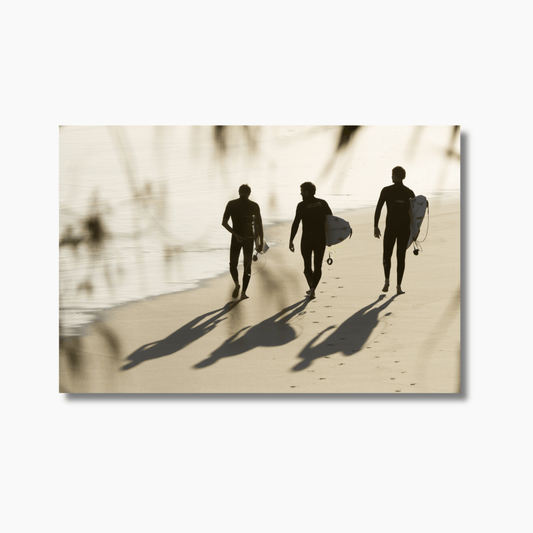 Three surfers walking along the beach at sunset in silhouette at Snapper Rocks, Gold Coast — limited edition fine art surf photography print.