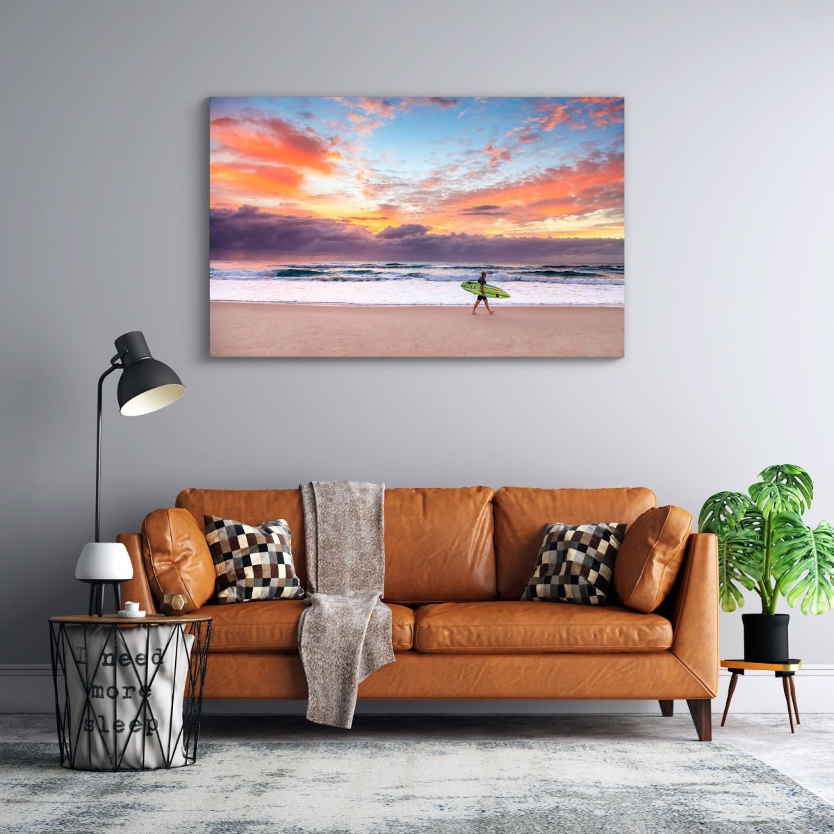 Fine art wall print of a surfer at sunrise on the Gold Coast, displayed in a serene coastal-inspired room.