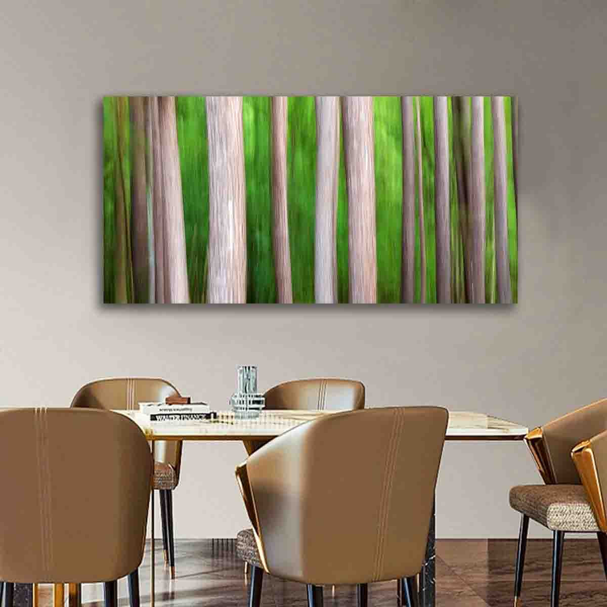 Nature-inspired abstract fine art print of vertical forest trees hanging in a modern minimalist interior.