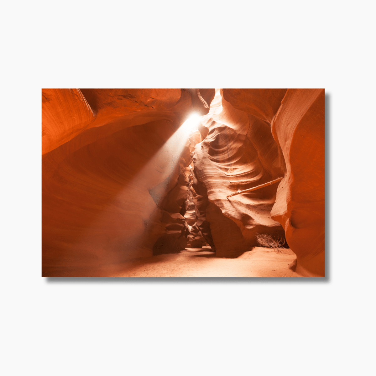 Sunlight streaming through the narrow passage of Antelope Canyon, illuminating the desert landscape with a stunning ray of light.
