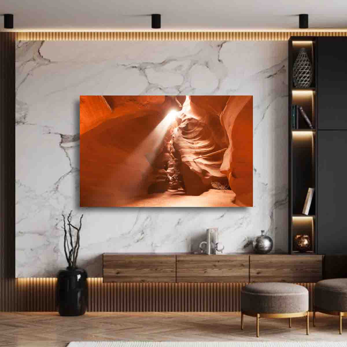 Desert landscape fine art print of sunlight filtering through Antelope Canyon, displayed in a modern living room with earthy tones.