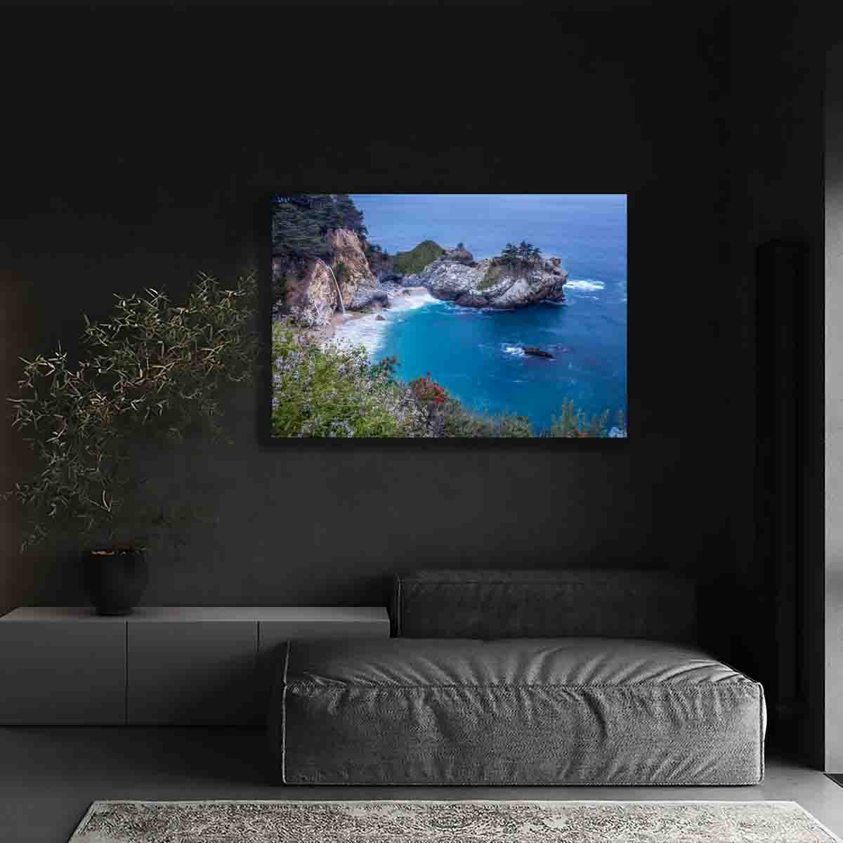 A fine art photograph of McWay Falls in Big Sur, California, cascading into the Pacific Ocean at golden hour. Limited edition coastal wall art print.