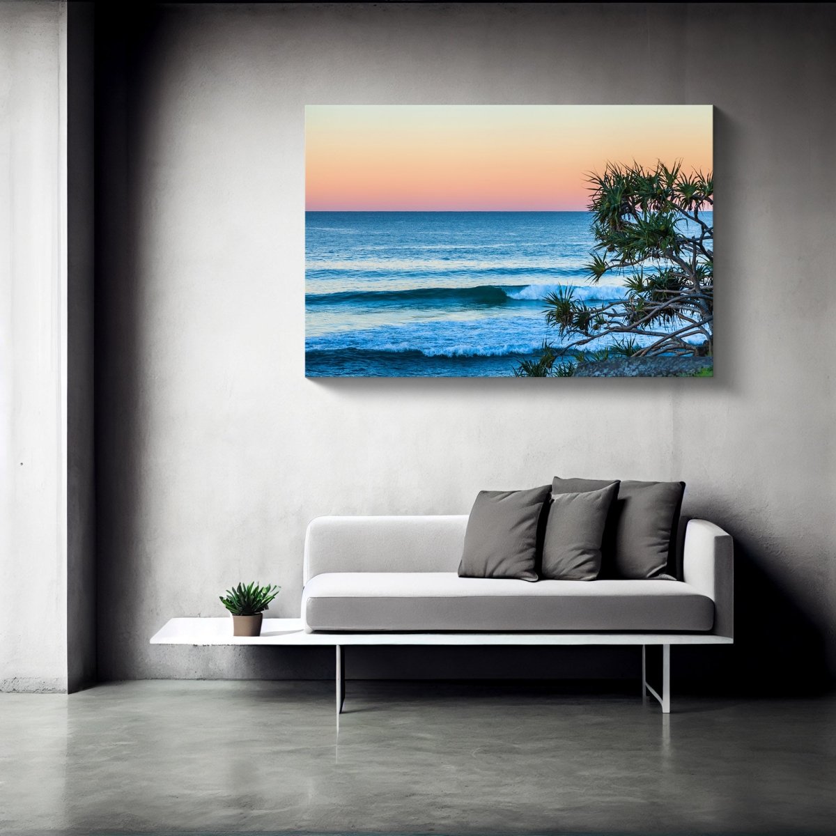Burleigh Heads beach sunrise canvas print hanging on a modern interior wall, featuring soft pastel skies and ocean tones in a coastal-themed room.