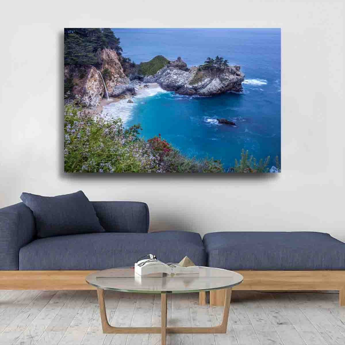 A fine art photograph of McWay Falls in Big Sur, California, cascading into the Pacific Ocean at golden hour. Limited edition coastal wall art print.