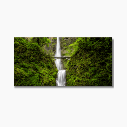Multnomah Falls in Oregon, captured as a vertical fine art waterfall print with mist and greenery.
