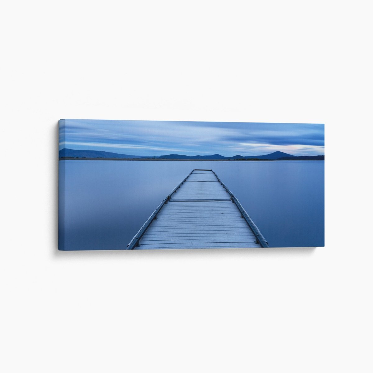 Oregon jetty at sunrise extending over a calm lake, reflecting soft morning light—tranquil Pacific Northwest fine art landscape.