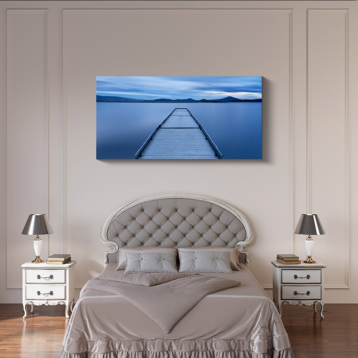Oregon Jetty fine art print of a lakeside sunrise displayed in a modern interior, featuring calm water and a rocky jetty at dawn.