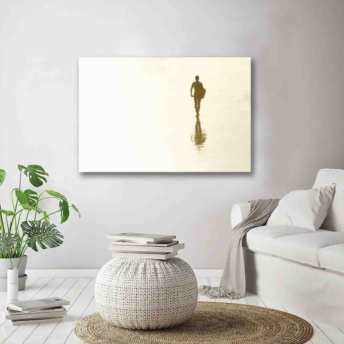 Beach-inspired fine art print of a surfer’s reflection at sunset on wet sand, displayed in a modern coastal living room.