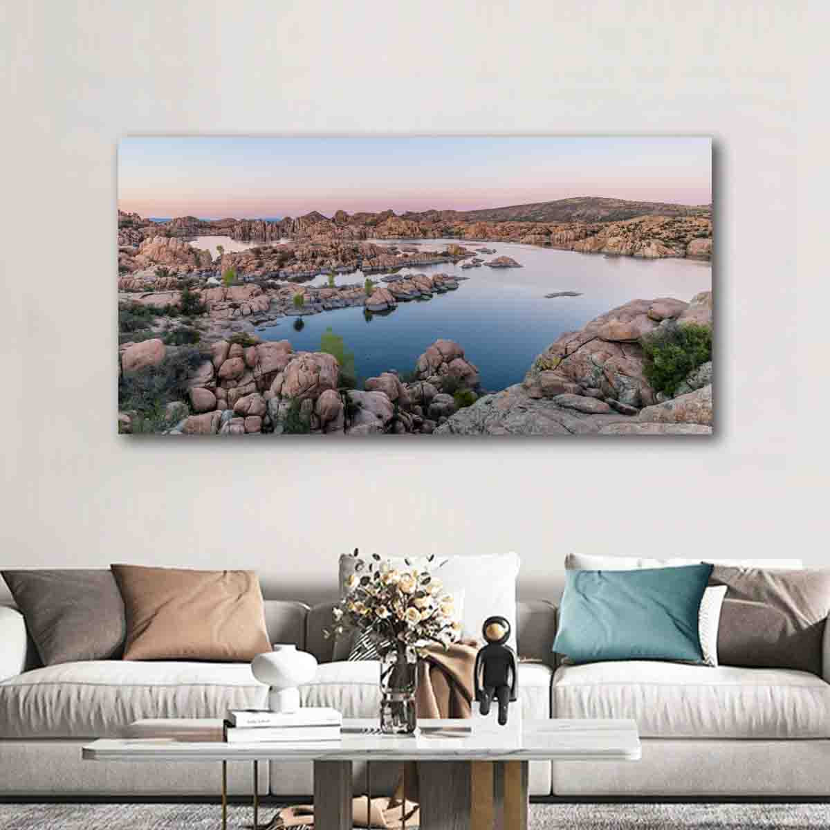 Watson Lake sunset wall art print with soft pastel reflections and boulders, displayed in a tranquil modern interior.