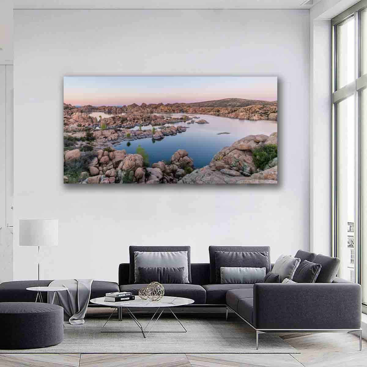 Watson Lake sunset wall art print with soft pastel reflections and boulders, displayed in a tranquil modern interior.