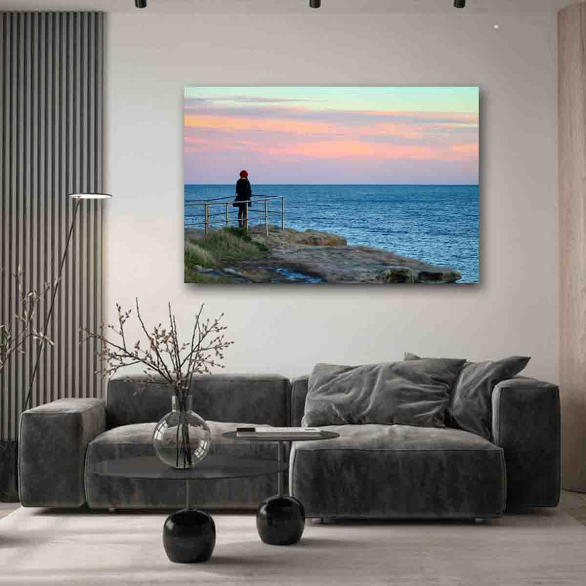Bondi Beach ocean photography print with girl at lookout, displayed in a minimalist coastal interior.
