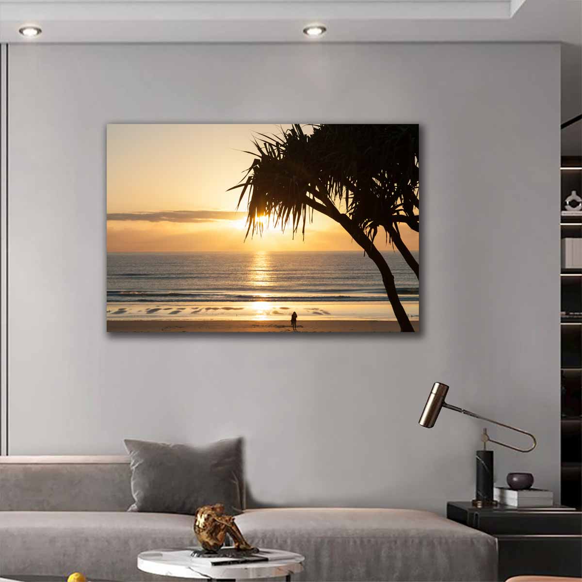 Australian sunrise photo of a figure beneath a tree by the beach, displayed in a calm, coastal-inspired interior.