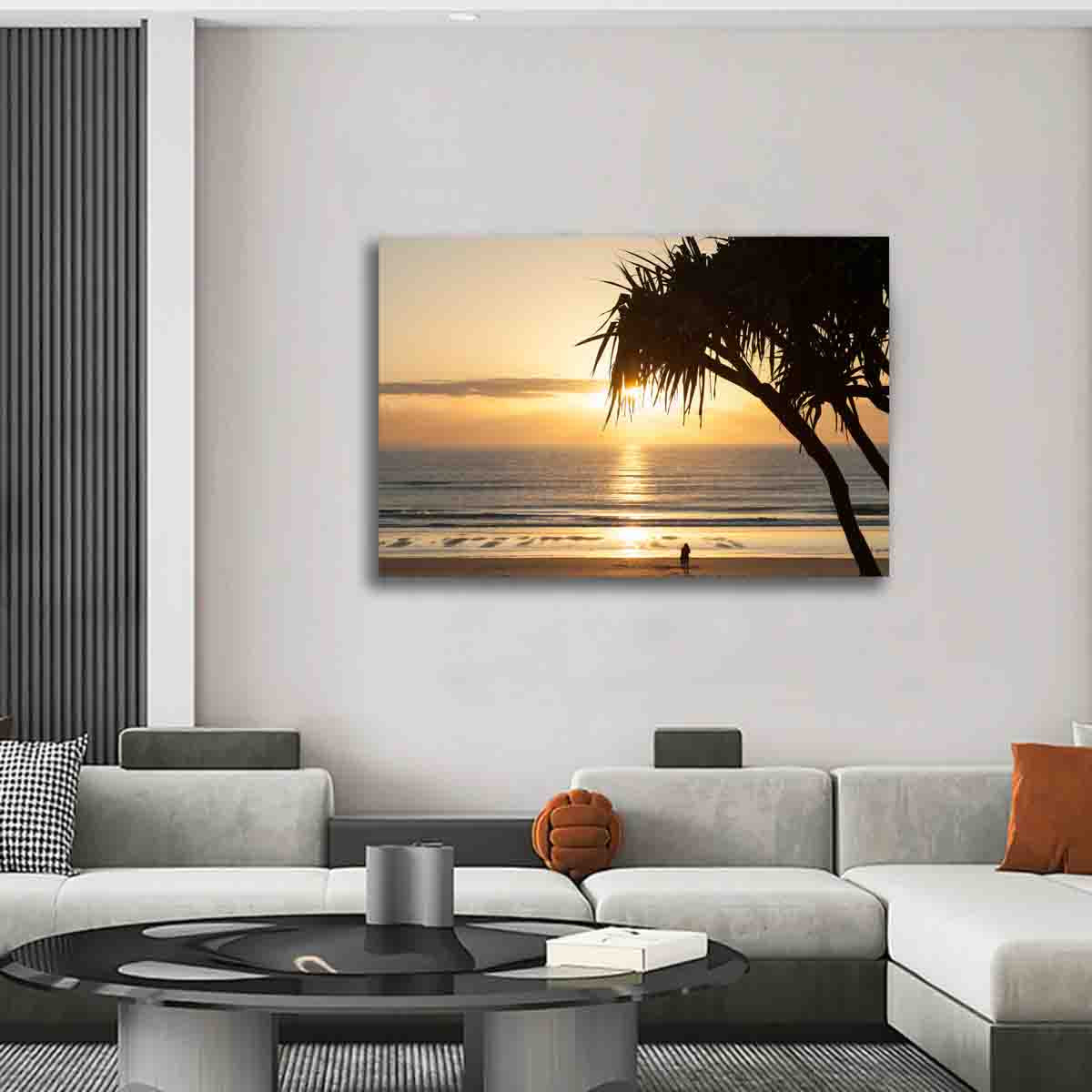 Australian sunrise photo of a figure beneath a tree by the beach, displayed in a calm, coastal-inspired interior.