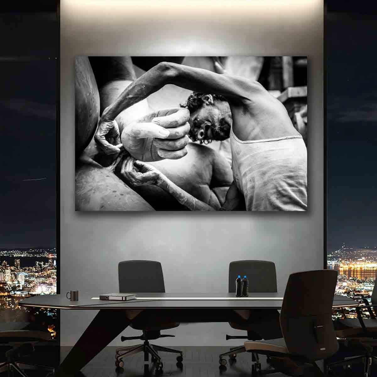 Fine art photo print of a sculptor shaping clay in Kolkata’s Kumartuli district, displayed in a serene, culturally inspired room.