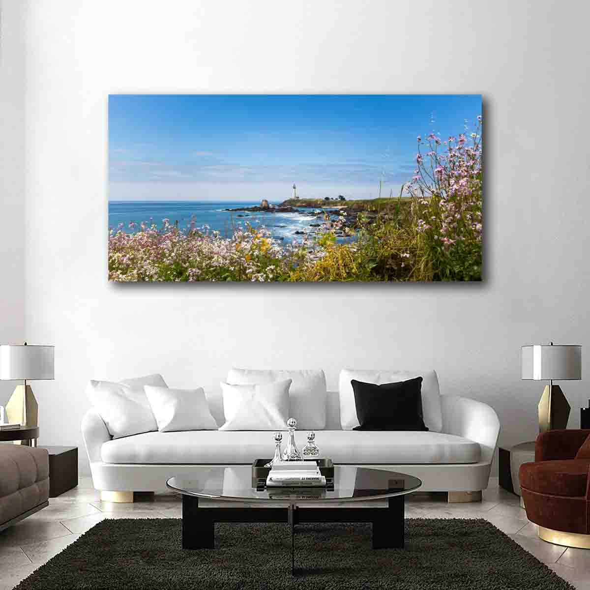 Coastal Harmony lighthouse wall art print displayed in a beach-themed interior with natural wood and soft neutral styling.