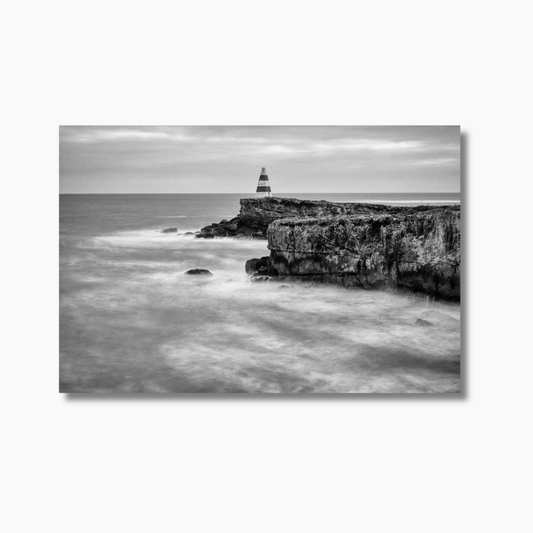Black and white coastal wall art print by Dan Lewin, captured in Robe, South Australia — featuring a solitary figure at low tide.