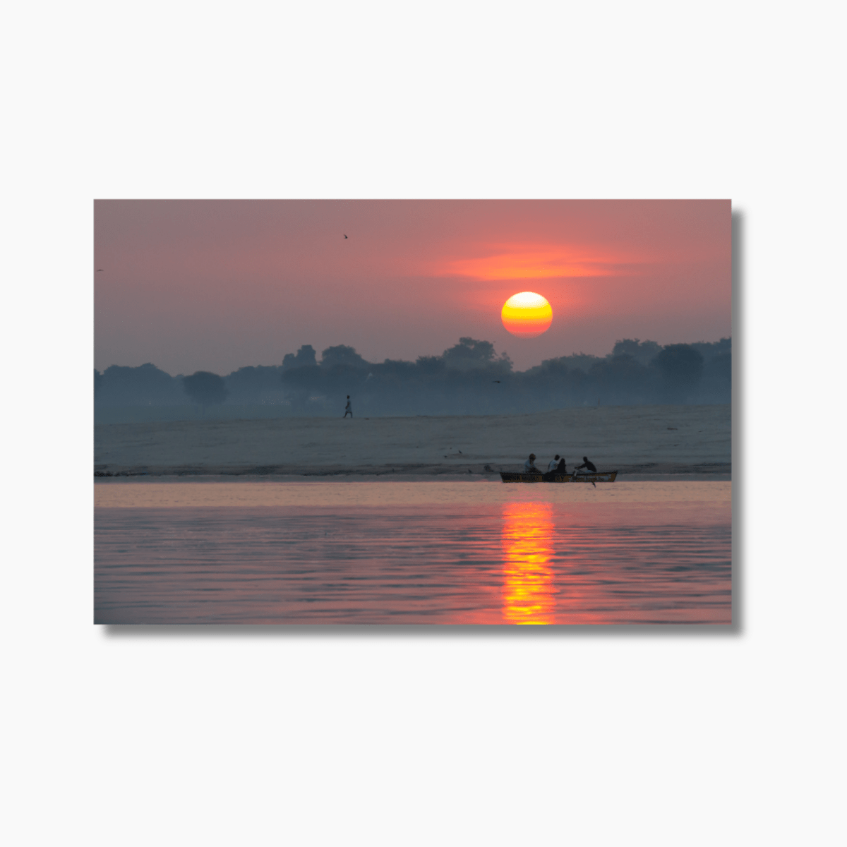 Boat on the Ganges River at sunrise in Varanasi, India — limited edition fine art photography print with golden light and spiritual atmosphere.