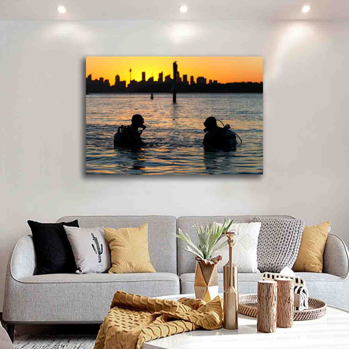 Sydney Harbour sunset photography print with divers and city skyline, displayed in a modern coastal-inspired interior.
