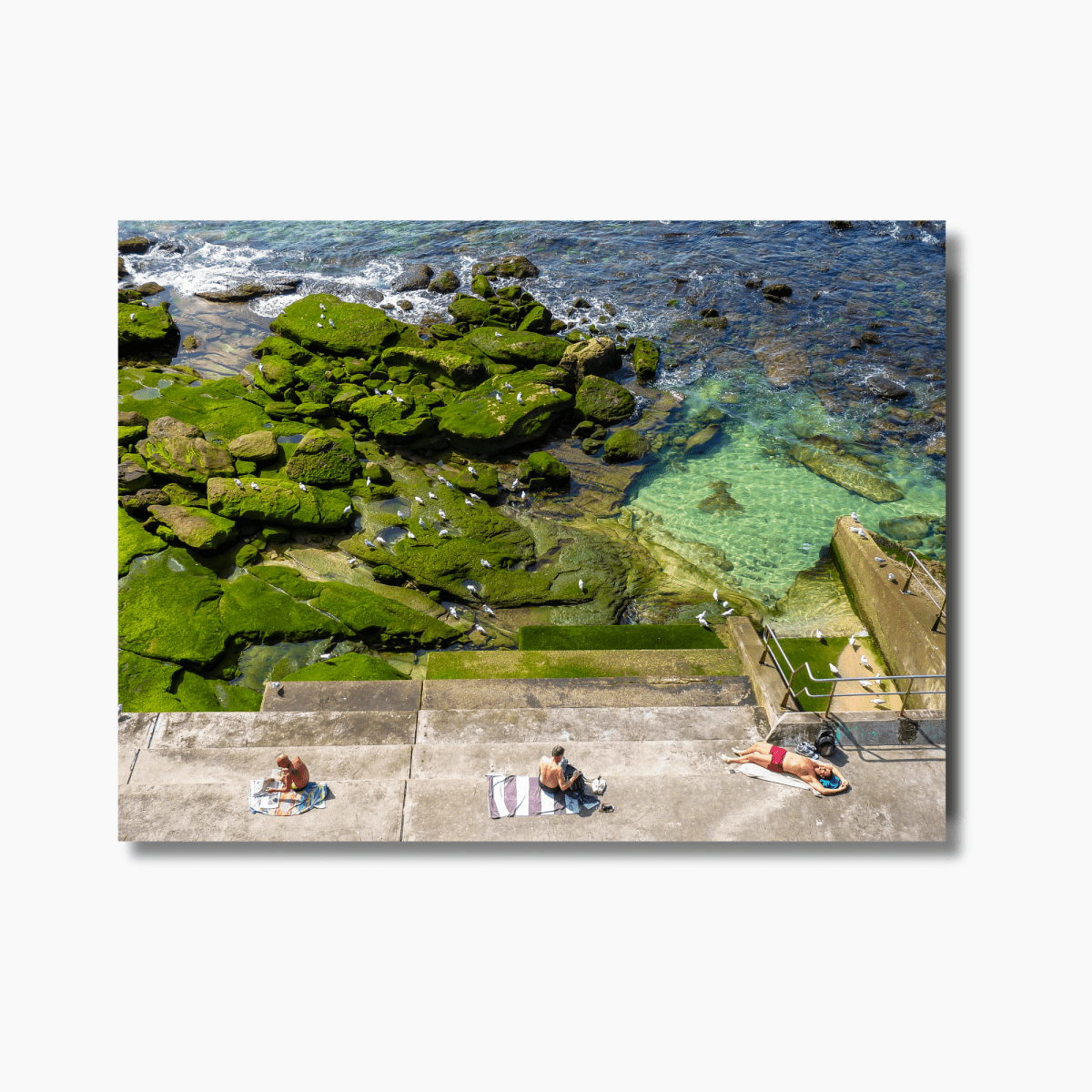 People sunbaking on cement wall at Bondi Beach, Sydney — limited edition Australian coastal photography print.